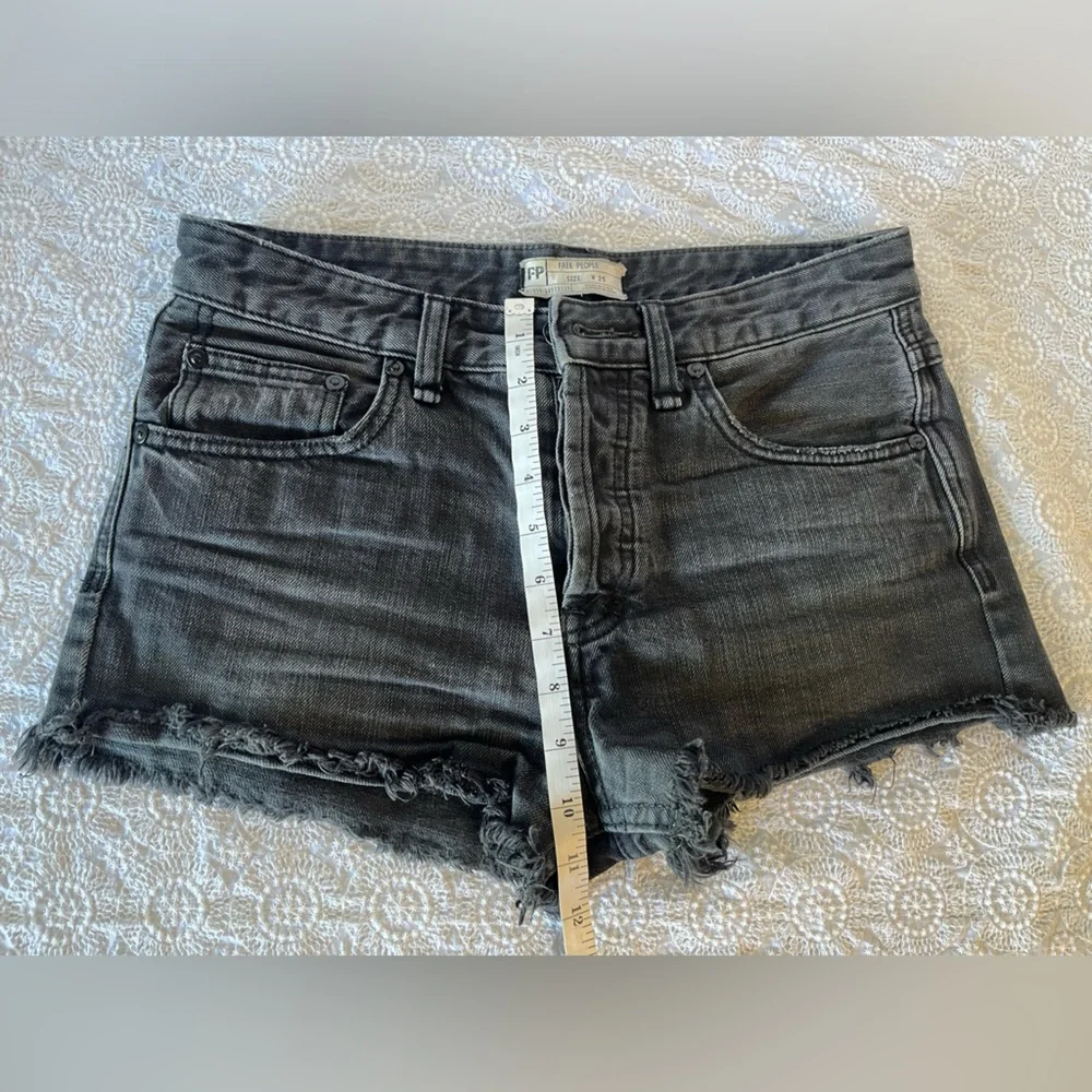 Free People black cut-off shorts, size 25; distressed black denim with raw hem